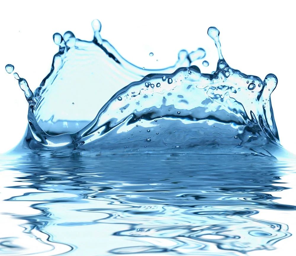 Clear water moving across a dark blue surface